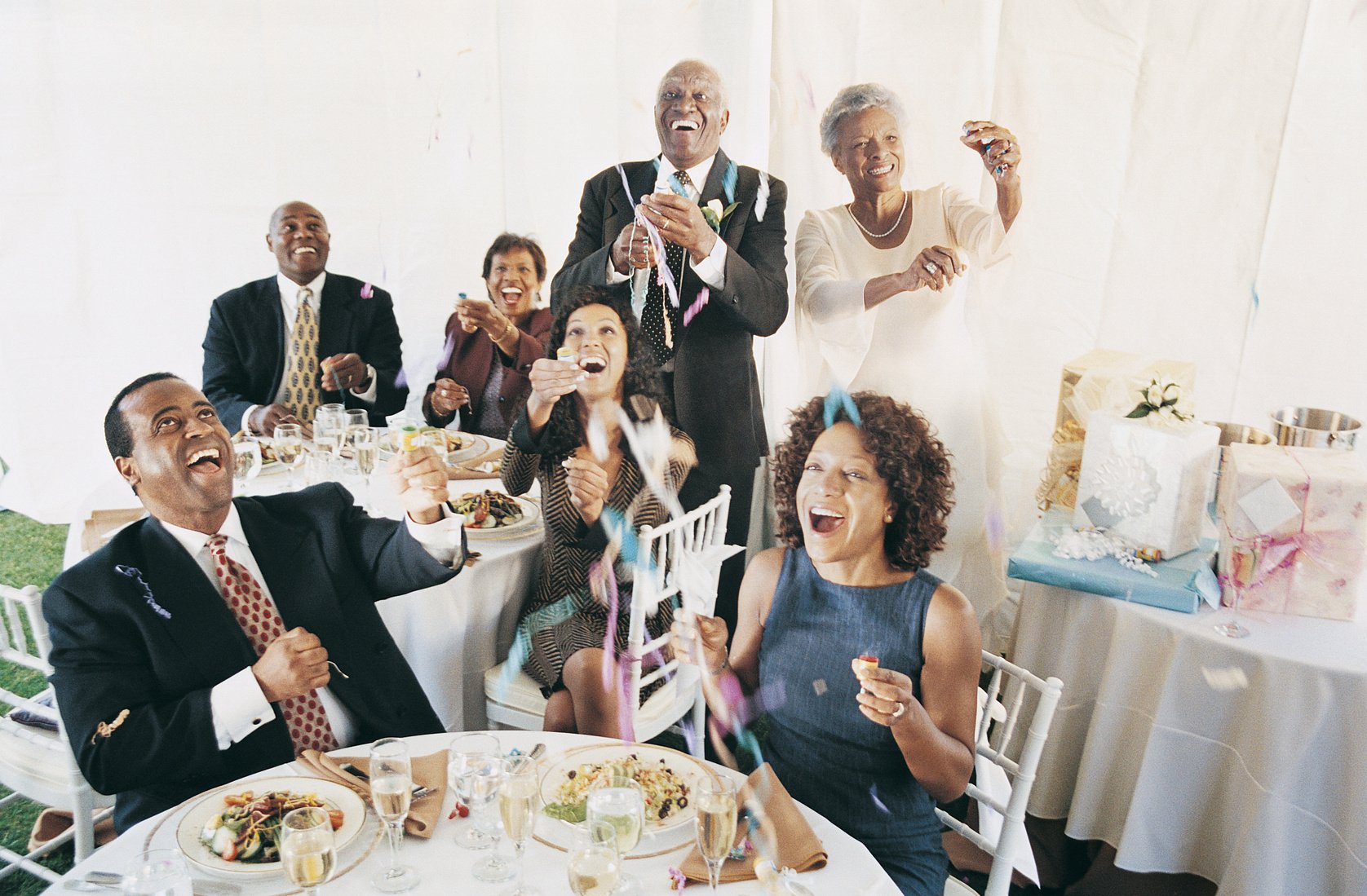 People Launching Streamers at a Wedding Reception